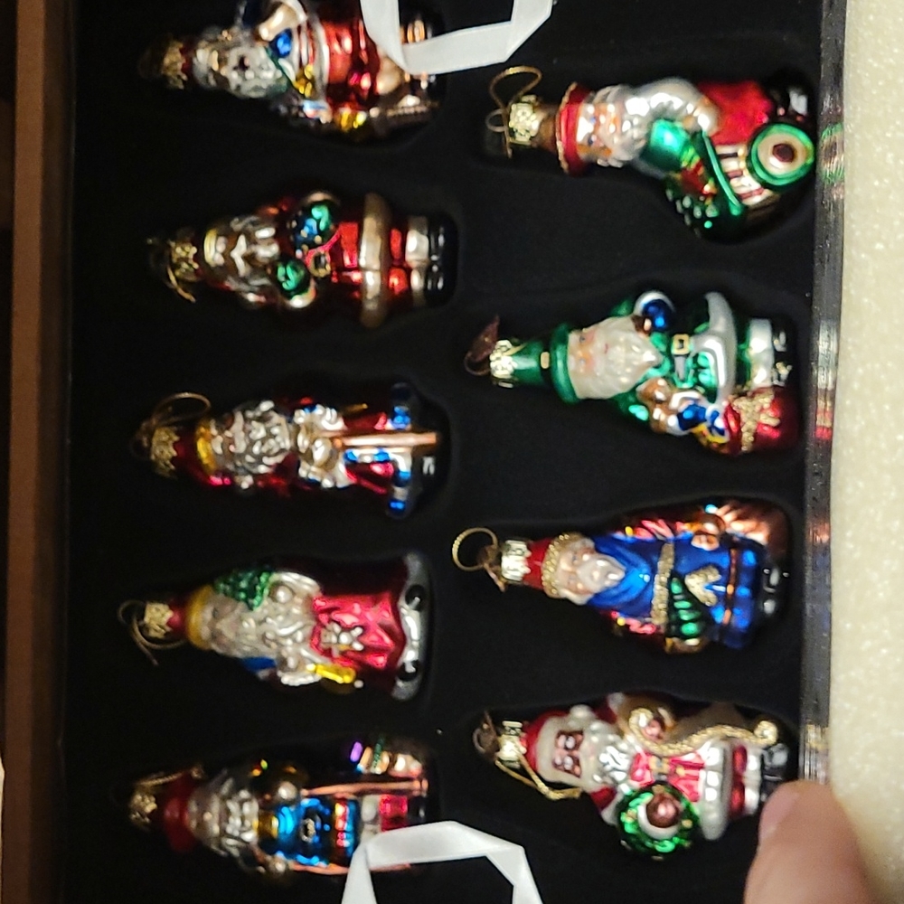 Crate of blown glass santas